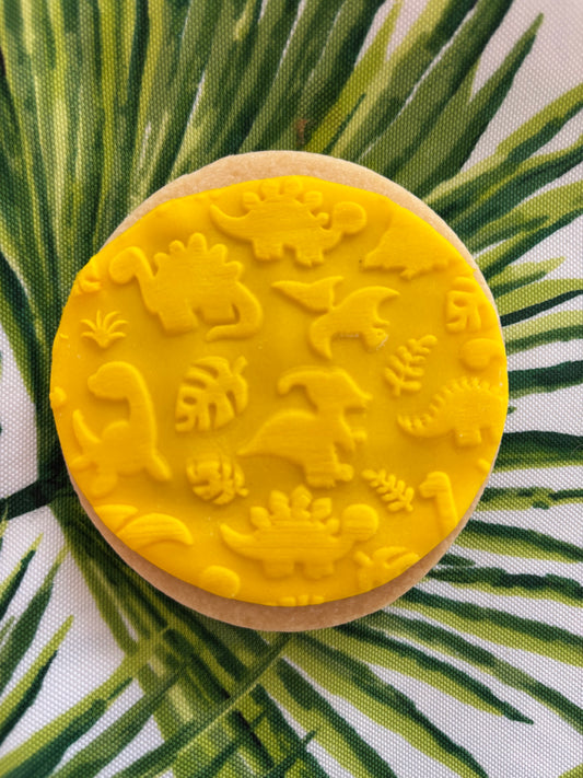 Yellow round dinosaur patterned cookie